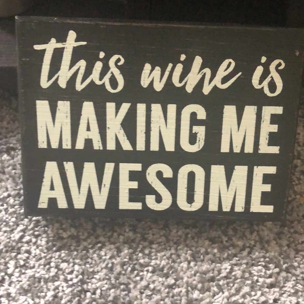 distressed wooden wine sign